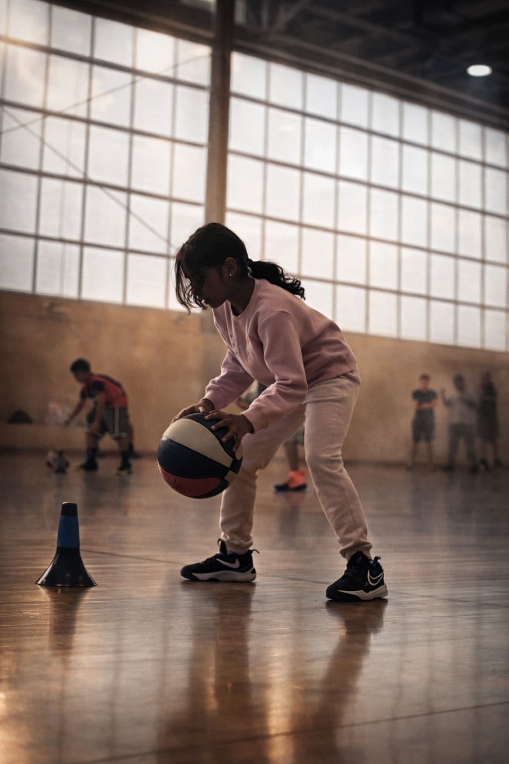 Player practising basketball fundamentals with coaching cones